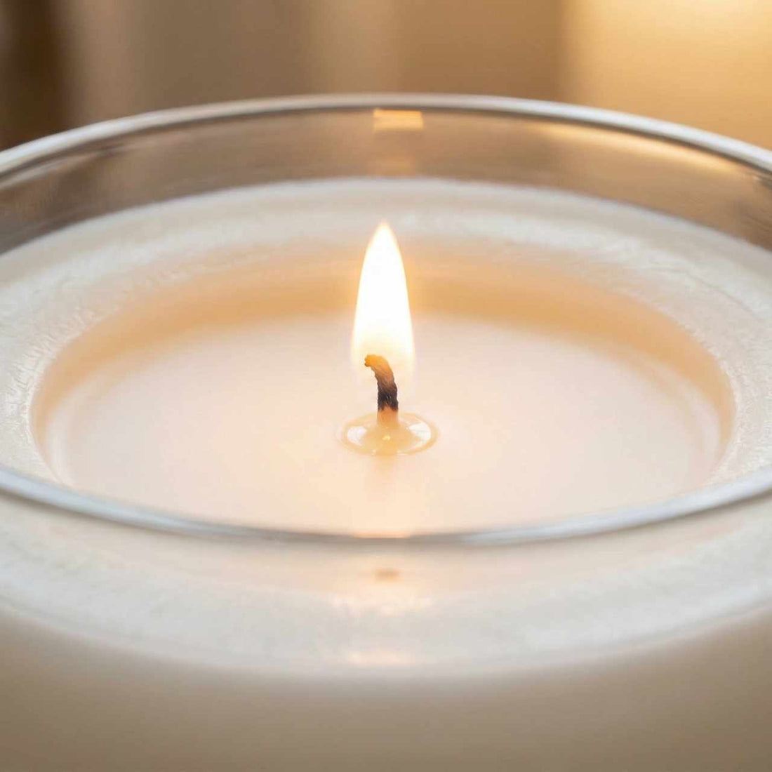 a close up of a lit candle