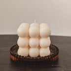 Bubble candle  front view inside an amber glass thinket for candles