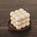 Bubble candle  front top view inside an amber glass thinket for candles